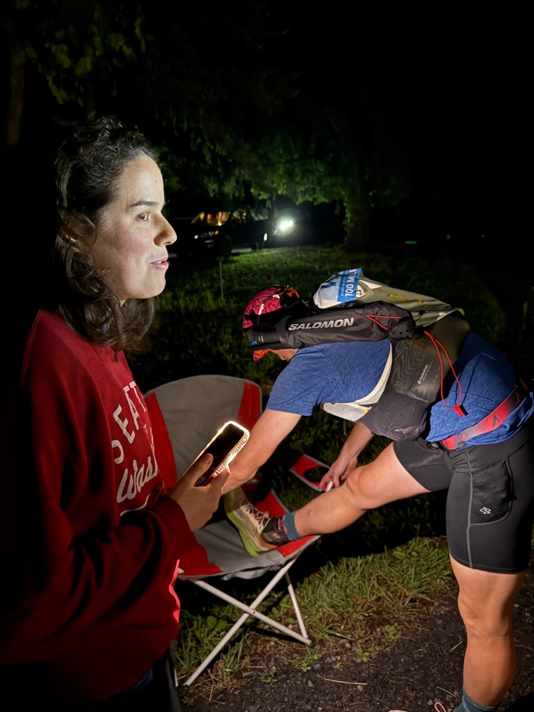Patrick stretching his leg (again) at the Visitor Center aid station.