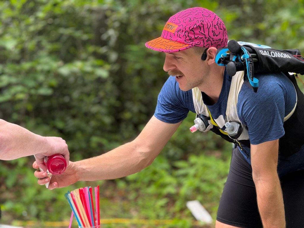 Patrick receiving a snow cone at Gap Creek II aid station.